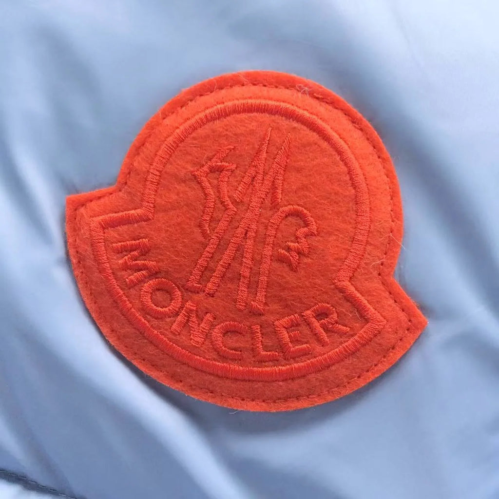Moncler Ice Blue Hooded Puffer Jacket – Orange Logo Patch & Contrast Hood Lining